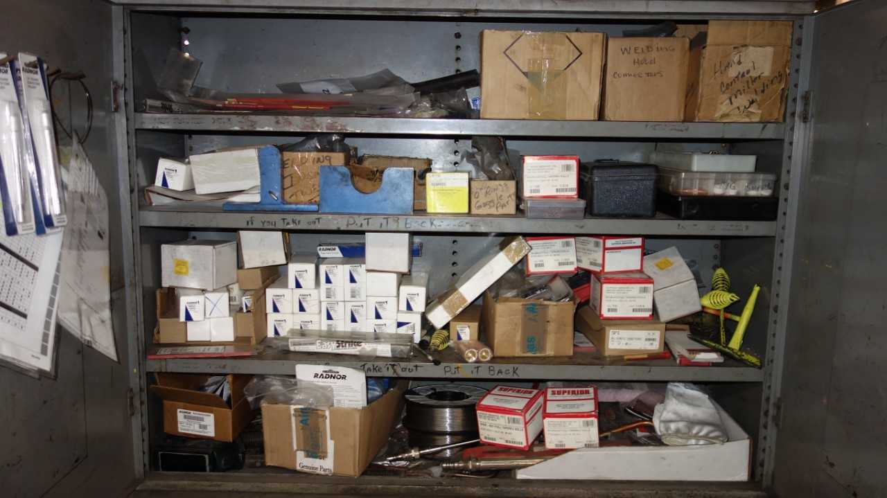 CABINET WITH CONTENTS, ASSORTED WELDING ACCESSORIES, NOZZLES, AND WIRE - WELDING EQUIPMENT