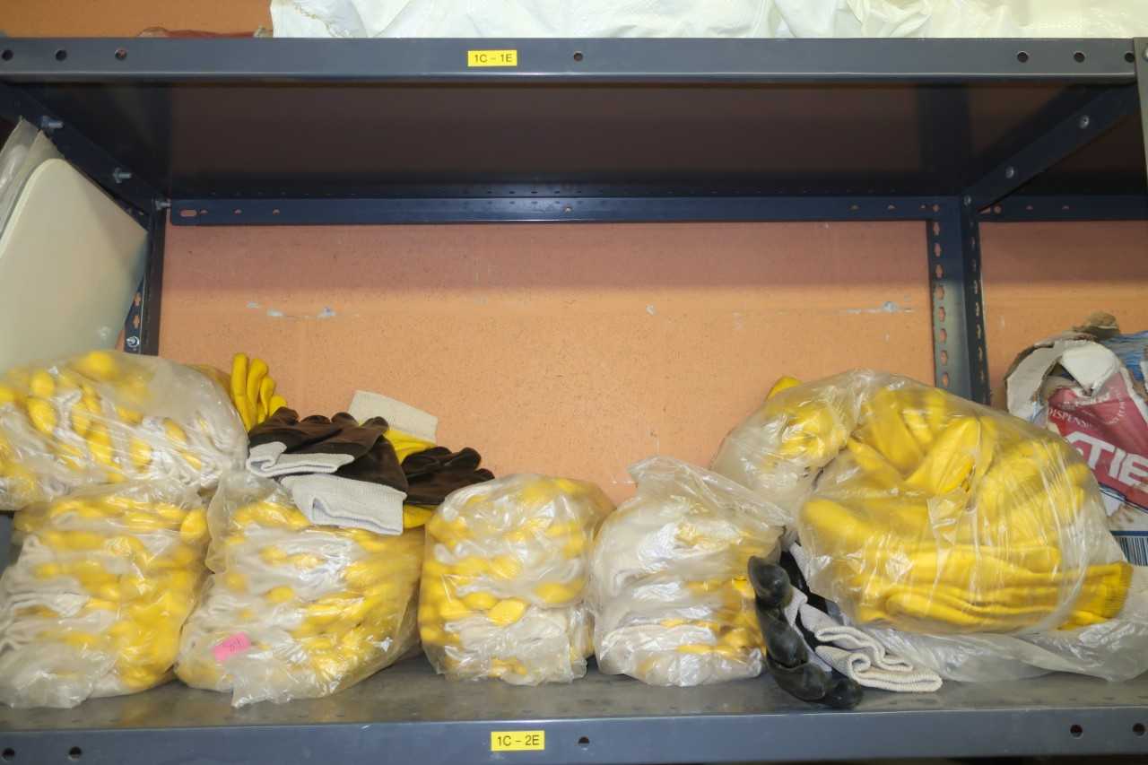 CONTENTS OF SHELF, ASSORTED SAFETY SUPPLIES, GLOVES, FIRST AID KIT, SPILL KIT, SAFETY SIGNS - SAFETY EQUIPMENT