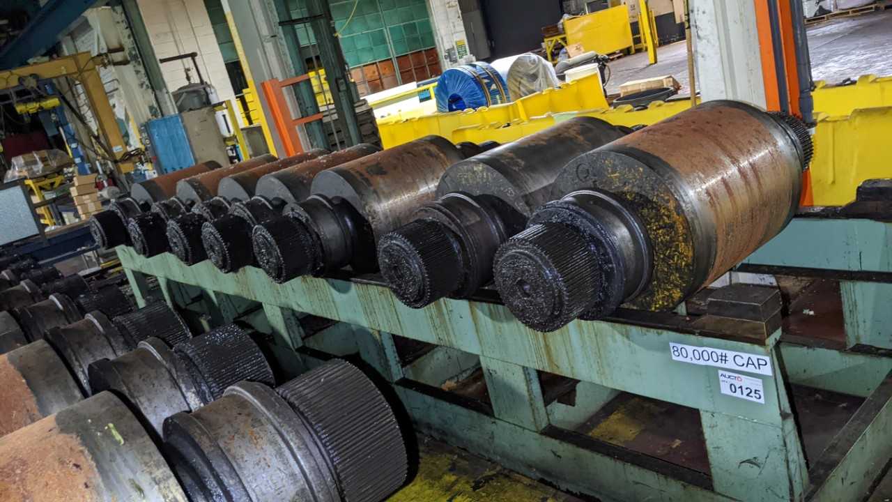 Lot of 7 steel rolls with rack