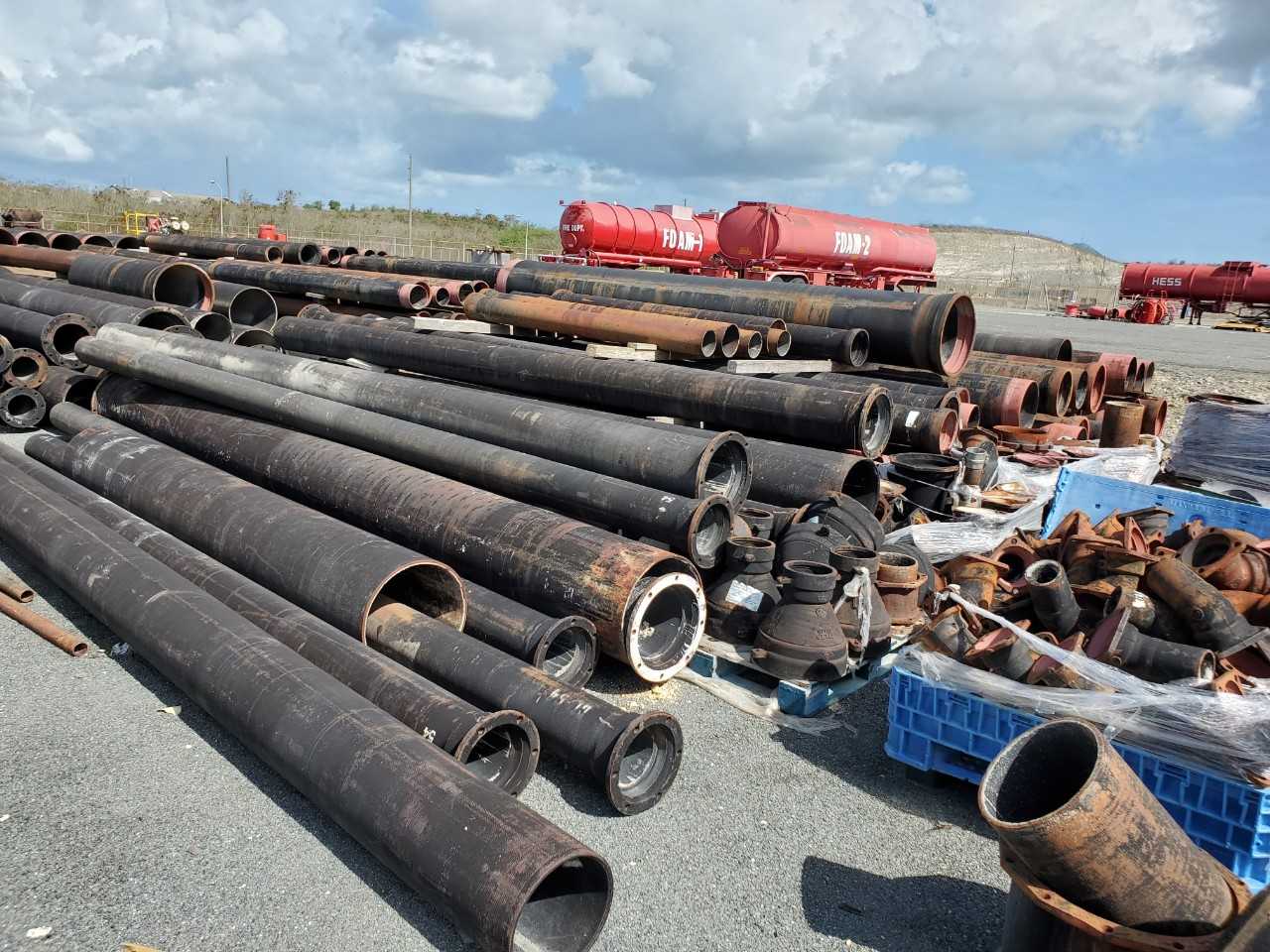 ROW OF ASSORTED US PIPE TYTON JOINT DUCTILE IRON PIPES, 8IN, 10IN, 12IN, 14IN, 16IN, 18IN, 20IN, 24IN - HAND TOOLS