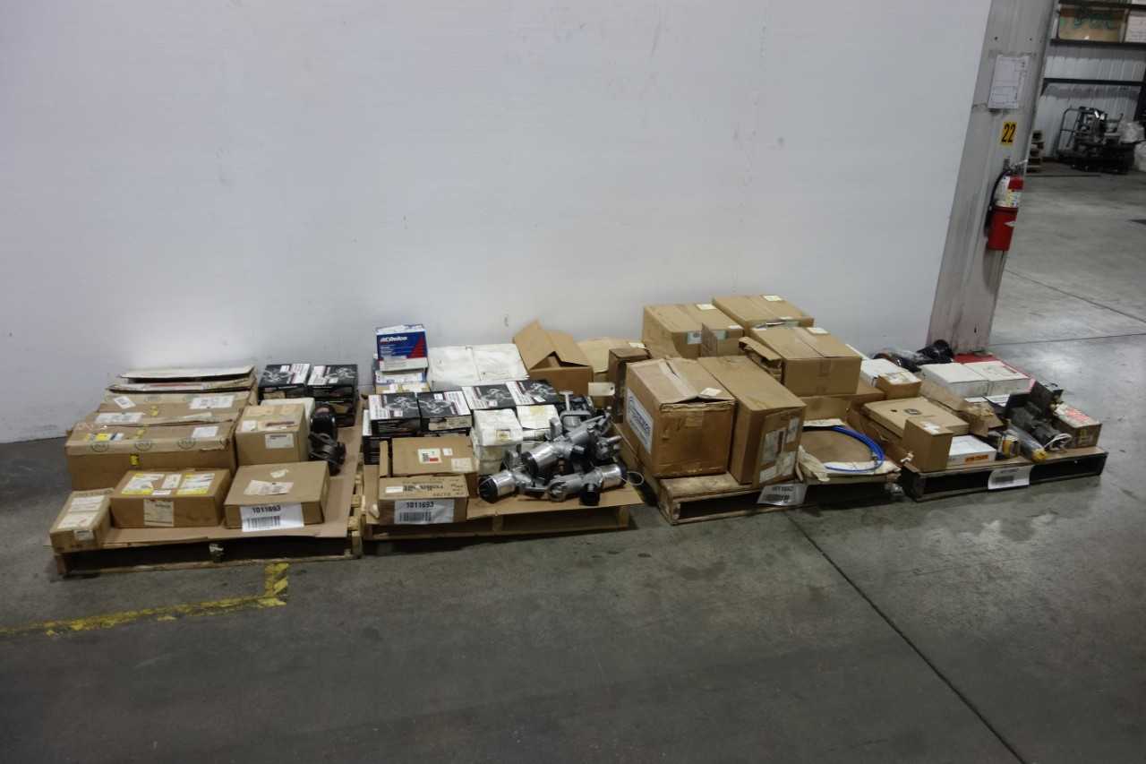 4 PALLETS OF ASSORTED HEAVY EQUIPMENT - CONSTRUCTION