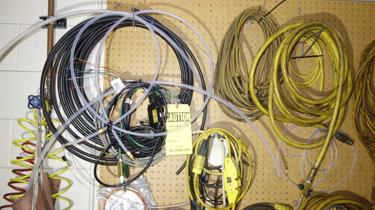 CONTENTS OF WALL SECTION, ASSORTED CABLES, HOSES - INDUSTRIAL PARTS