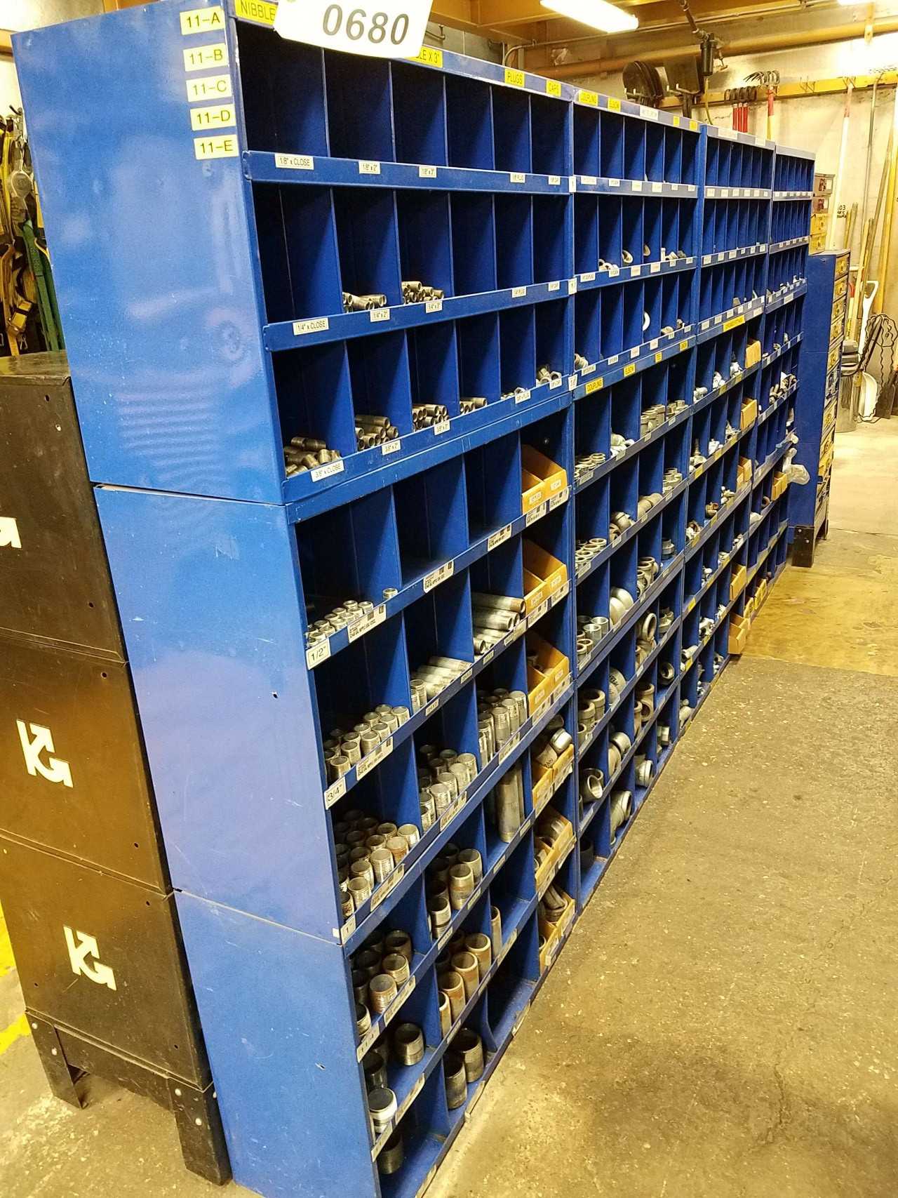 Lot of pigeon hole shelving with pipe couples, fittings, and nipples - PROCESS EQUIPMENT Lot of pigeon hole shelving with pipe couples, fittings, and nipples - PROCESS EQUIPMENT