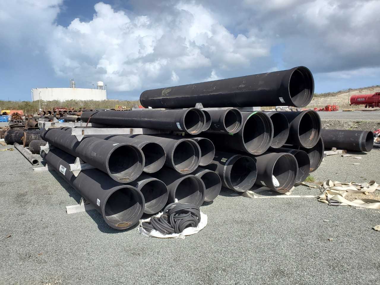 ROW OF ASSORTED US PIPE TYTON JOINT DUCTILE IRON PIPES, 12IN,16IN,18IN, 24IN, 30IN - HAND TOOLS