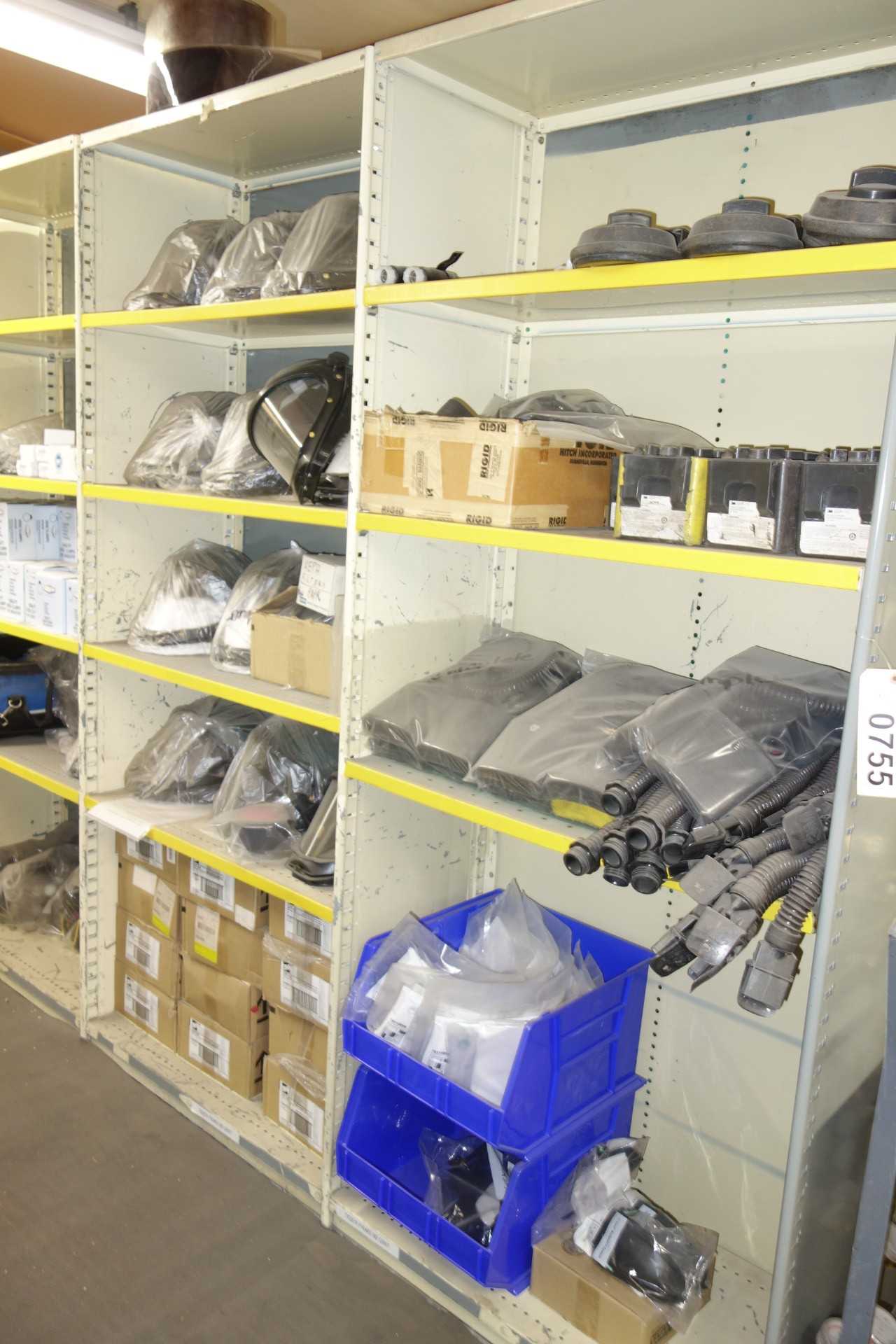 Contents of 5x sections shelving - HEPA filters, coveralls, gloves, protective wear - SHELVING