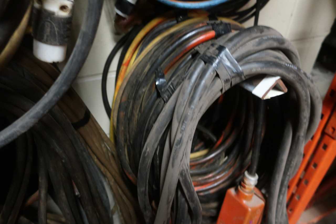 CONTENTS OF 4 HOOKS, ASSORTED ELECTRICAL CABLE, EXTENSION CORDS, RECEPTACLE CABLES - ELECTRICAL COMPONENTS